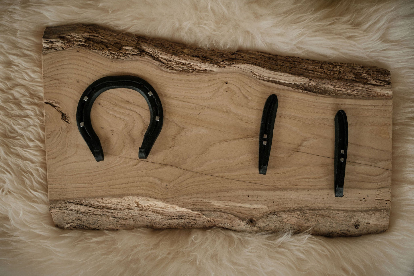 Horseshoe hooks mounted on live edge, kiln-dried Sweet Chestnut board